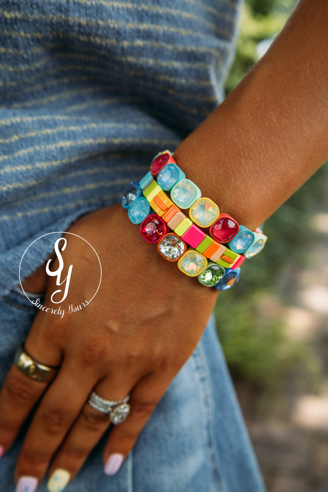 Colorful beaded bracelet on a wrist with a blurred background