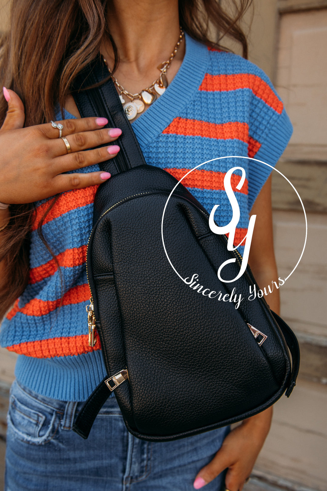 black leather sling bag backpack Canvas while the top buckle closure ensures the security of your belongings CHAMPS Onyx Collection 7.5 in.,