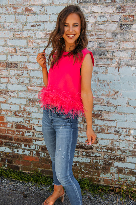 This top has to be one of our new FAVS!! Pair it with jeans and heels for the perfect girly girl on the go look!! No matter what occasion, it will be sure to make a statement this summer!  Liz is 5'3 wearing a size small feather trim detailing 95% polyester, 5% spandex