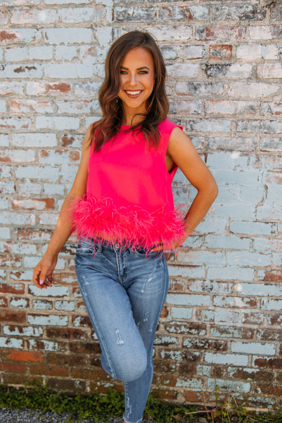 This top has to be one of our new FAVS!! Pair it with jeans and heels for the perfect girly girl on the go look!! No matter what occasion, it will be sure to make a statement this summer!  Liz is 5'3 wearing a size small feather trim detailing 95% polyester, 5% spandex